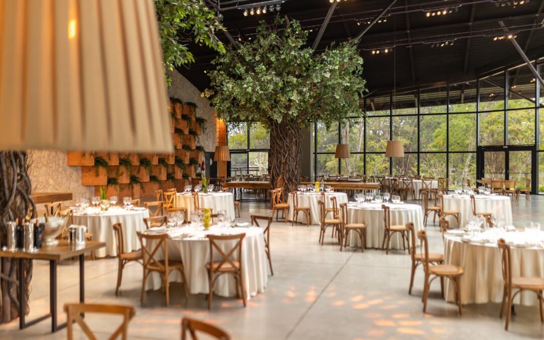 a massive room with a bunch of tables ready for a catered event