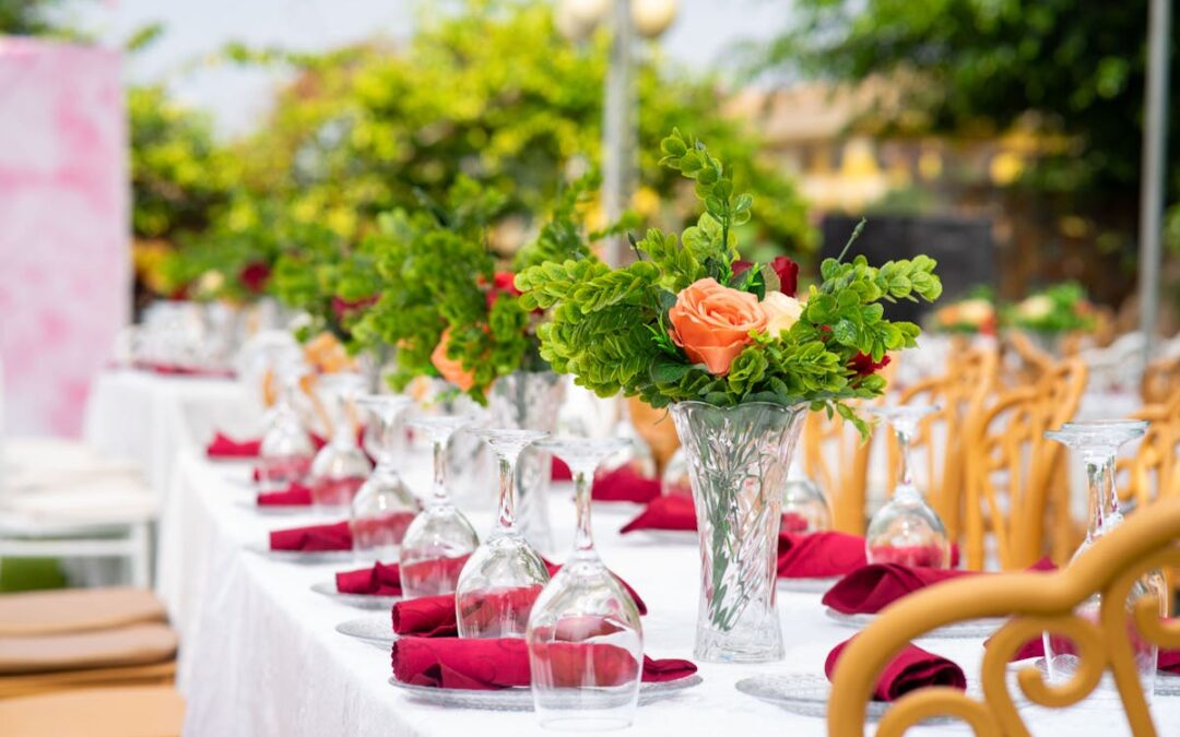 a massive table with a ton of flowers on it ready for the caterer