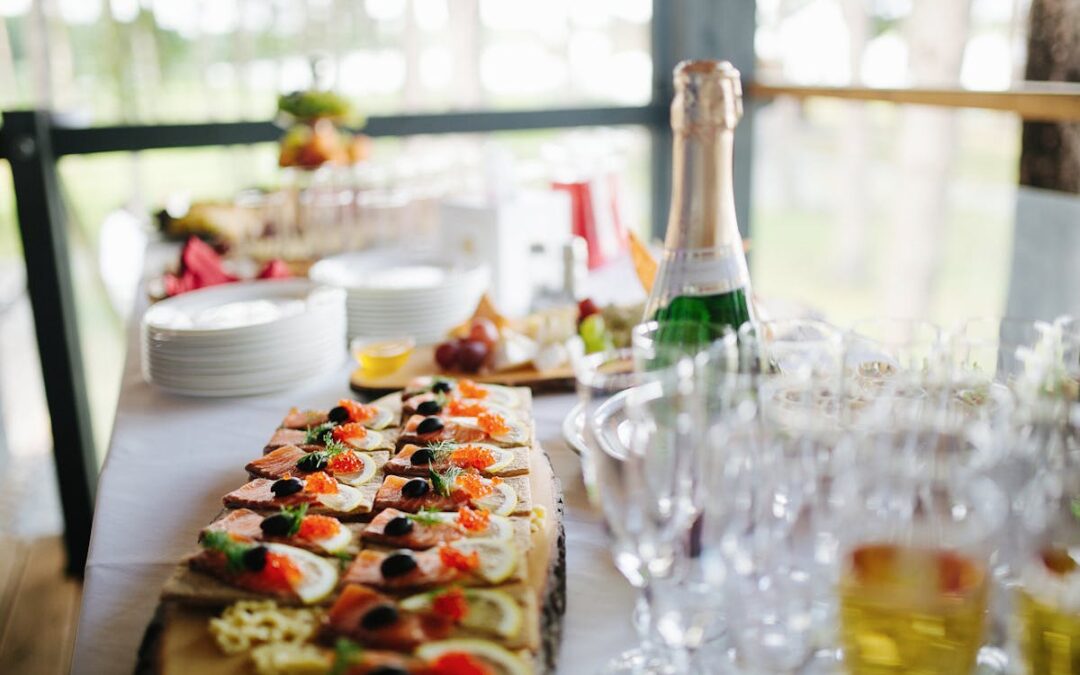 a table with a ton of food and drinks on it from a caterer